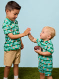 Load image into Gallery viewer, Tackles & Touchdowns Football  Performance Polo Romper
